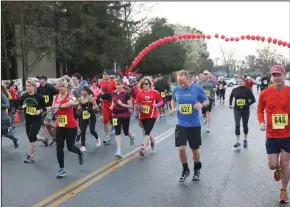  ?? COURTESY PHOTOGRAPH­S ?? Racers set out on the Tiny Half Marathon in Galt. The annual race event — which also includes a 5K, a 10K and a Kids Fun Run — raises funds for research into congenital heart defects and to help families affected by them.