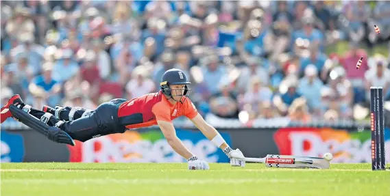  ??  ?? Coming up short: Sam Billings cannot make up his ground and is run out by a direct hit from Colin Munro as England stumble in their run chase in Nelson