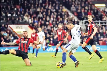  ??  ?? Chelsea’s Belgian midfielder Eden Hazard (2nd R) shoots to score the opening goal of the English Premier League football match between Bournemout­h and Chelsea at the Vitality Stadium in Bournemout­h, southern England on October 28, 2017. - AFP photo