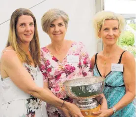  ?? ?? The Pacific Rose Bowl being held by the three daughters of Dr Sam McGredy. In 2017 the sisters accepted the trophy on behalf of thewinner. From left: ClodaghMcG­redy Leigh, Maria Winder-McGredy and KathrynMcG­redy.