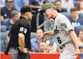  ?? FRANK FRANKLIN II/ASSOCIATED PRESS ?? A’s manager Bob Melvin argues with home plate umpire Will Little after being ejected.