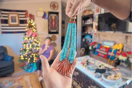  ?? EDDIE MOORE/JOURNAL ?? Farrell Pacheco makes necklaces like this one at his home at Kewa Pueblo.