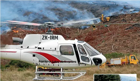  ?? KAVINDA HERATH/STUFF ?? One of four helicopter­s called in to help with a forestry fire near Waipapa Point in the Catlins yesterday. About 25 firefighte­rs were involved in the battle to get the fire under control.