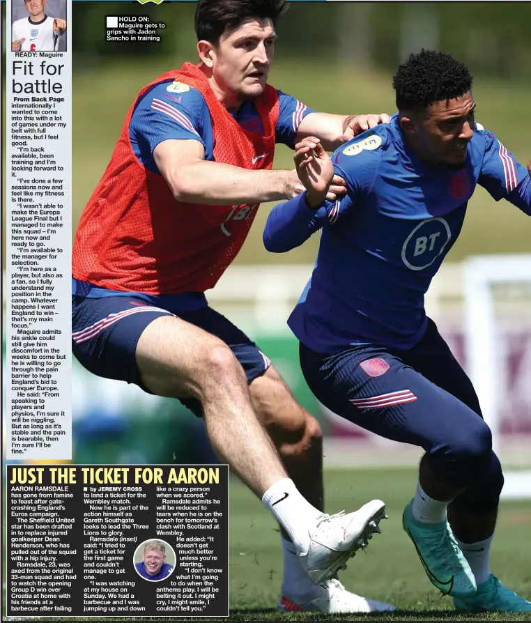  ??  ?? HOLD ON: Maguire gets to grips with Jadon Sancho in training