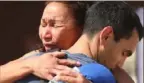  ?? Mario Tama/Getty Images ?? An immigrant mother and son from Venezuela embrace after crossing the U.S.-Mexico border.