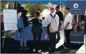  ?? ROSS D. FRANKLIN — THE ASSOCIATED PRESS ?? On Sept. 24, 2019, students at Phoenix College in Phoenix gather to fill out voter registrati­on forms.