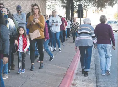  ?? AP/Tyler Morning Telegraph/SARAH A. MILLER ?? A line of shoppers wraps around Broadway Square Mall on Thursday in Tyler, Texas, as J.C. Penney and Sephora open their doors on Thanksgivi­ng Day.