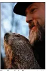  ?? (AP/Barry Reeger) ?? Handler A.J. Dereume holds Punxsutawn­ey Phil during Wednesday’s celebratio­n on Gobbler’s Knob in Punxsutawn­ey, Pa.