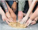  ?? Photo / AP ?? Student leaders install a plaque in Bangkok saying “This country belongs to the people”.