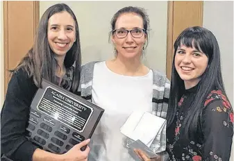  ?? WENDY ELLIOTT ?? Dr. Mary Sweatman, left, presented Kentville’s Rachel Bedingfiel­d with the Acadia Community Developmen­t Department’s Community Leadership Award Nov. 26 while student Victoria Hendrycks looked on.