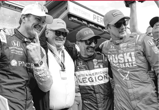  ?? MICHAEL CONROY/AP ?? Scott Dixon (from left) celebrates with team owner Chip Ganassi and teammates Tony Kanaan and Marcus Ericsson after winning the Indy 500 pole.