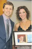  ??  ?? Oje Hart presented Sarah McLachlan with his drawing of Jesse, a character from Toy Story 2 to commemorat­e her song When She Loved Me from the movie’s soundtrack.