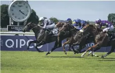  ?? Getty ?? Stephane Pasquier, onboard Study Of Man (No 10), won trainer Pascal Bary a sixth title in the Prix du Jockey Club race