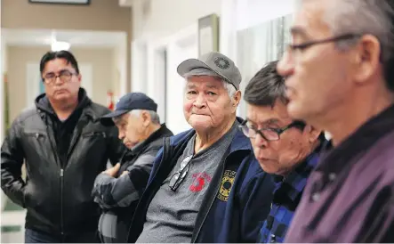  ?? CHAD HIPOLITO /THE CANADIAN PRESS ?? From left, Hereditary Chief Smogelgem, Chief Warner Williams, Chief Madeek, Chief Hagwilnegh­l and Chief NaMoks met with RCMP members and Coastal GasLink representa­tives on Thursday. The blockade on Wet’suwet’en land was removed.