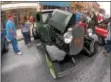  ??  ?? Spectators gather around a very old, restored vehicle and survey the inside as well.