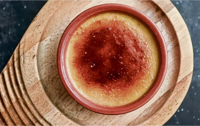  ?? ?? CREAM OF THE CROP: With dishes such as olivas marinadas and calamares fritos on offer, it’s hard to leave space, but a dessert of crema catalana is a vanilla-filled treat.