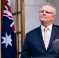  ?? GETTY IMAGES ?? Prime Minister Scott Morrison in Canberra yesterday outlines a new plan agreed to by the National Cabinet to start easing restrictio­ns imposed in response to the Covid-19 pandemic.