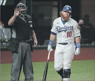  ??  ?? JUSTIN TURNER ISN’ T happy after being called out on strikes by umpire Todd Tichenor in the first inning. It was one of nine strikeouts by starter Blake Snell, and one of 15 by Rays pitchers.