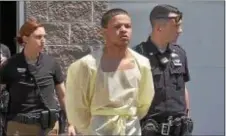  ?? 6ABC PHOTO ?? James Benton is led from the Darby Borough police station after his arrest on Tuesday.
