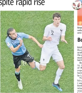  ??  ?? File photo shows Uruguay’s defender Diego Laxalt (left) vies for the header with France’s defender Benjamin Pavard during the Russia 2018 World Cup quarter-final football match between Uruguay and France at the Nizhny Novgorod Stadium in Nizhny...