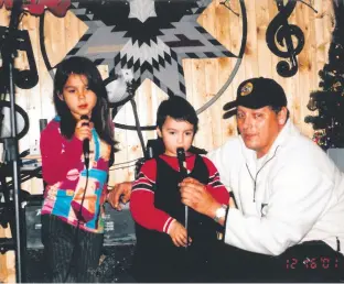  ?? CONTRIBUTE­D ?? Destiny Sylliboy and Alexander Denny are shown performing as children with the help of the organizer of the Eskasoni Christmas Telethon organizer, Robert Stevens.