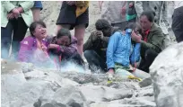  ?? AP Photo ?? Villagers mourn for loved ones who have been buried by the landslide in Maoxian county, in Sichuan province.