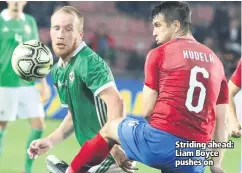  ??  ?? Striding ahead: Liam Boyce pushes on