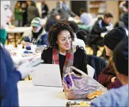  ?? ADAM CAIRNS / COLUMBUS DISPATCH ?? Volunteer Gina Wilt surveys Jane Gessells while breakfast is served at the Columbus Dream Center during the Community Shelter Board’s annual homeless count on Jan. 29.