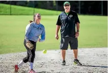  ??  ?? Former Black Sox pitcher Mike White - home in New Zealand to run pitching and catching clinics - watches New Zealand women’s team pitcher Rita Hokianga.