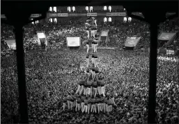  ?? Associated Press ?? ■ Members of "Vella de Xiquets de Valls" form their human tower during the 26th Human Tower Competitio­n on Sunday in Tarragona, Spain.