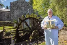  ??  ?? Owner James Tallon poses with bags of flour at Martry Mill in Kells, County Meath, Ireland.—AFP photos