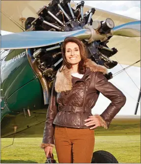  ??  ?? ‘DAMAGING’: Tracey Curtis-Taylor with her 1942 Boeing-Stearman biplane in 2015