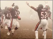  ?? AP file photo ?? Chicago Bears defensive back Maurice Douglass (37) celebrates with teammates after making an intercepti­on late in the Bears’ victory over the Philadelph­ia Eagles in a 1988 divisional playoff game, known as the Fog Bowl. The teams meet again in a wildcard playoff game Sunday.