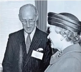  ?? ?? Moberly with Queen Elizabeth II: he was seen as too cautious against apartheid in South Africa