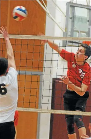  ?? GENE WALSH — DIGITAL FIRST MEDIA ?? Upper Dublin’s Matthew Ross spikes near Abington’s Shane Collins Tuesday night.