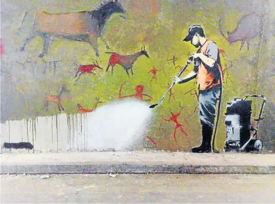  ??  ?? ¿Quién es Banksy? Hace unos días, un músico británico dio a entender que detrás de Banksy está Robert del Naja, líder de Massive Attack.