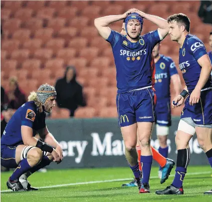  ?? PHOTO: GETTY IMAGES ?? Not a happy camp . . . Dejected Otago players (from left) Josh Dickson, James Lentjes and Michael Collins sum up the mood in Hamilton for the side last night.