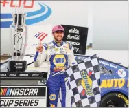  ?? Nell Redmond / Associated Press ?? Chase Elliott stands by his trophy in Victory Lane after winning at Charlotte Motor Speedway in Concord, N.C., on Oct. 11.