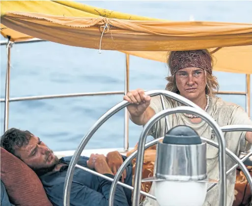  ?? STXFILMS VIA THE ASSOCIATED PRESS ?? Sam Claflin, left, and Shailene Woodley are affecting in their roles as lovers in Adrift, which is based on actual events.