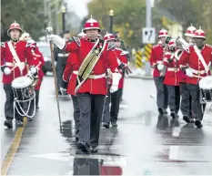  ?? JULIE JOCSAK/POSTMEDIA NEWS ?? The Lincoln and Welland Regiment Band marches to the Lake Street Armoury in St. Catharines for the change of command following a church service commemorat­ing the liberation of Bergen Op Zoom during the Second World War. The ceremony marked the change of command from Lt.-Col. Bruce Mair to Lt.-Col. Christophe­r Cincio.