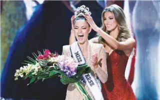  ?? REUTERSPIX ?? Nel-Peters reacts as she is crowned by Mittenaere during the 66th Miss Universe pageant at Planet Hollywood hotel-casino in Las Vegas on Sunday.