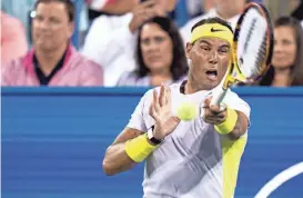  ?? ALBERT CESARE/USA TODAY NETWORK ?? Rafael Nadal hits a return to Borna Coric during the third set of their match in the 2022 Western & Southern Open.