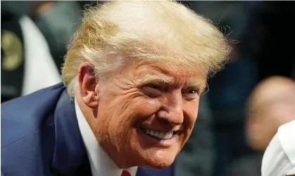  ?? Photograph: Sue Ogrocki/AP ?? Donald Trump smiles as he poses for a photo at the NCAA Wrestling Championsh­ips in Tulsa, Oklahoma, on Saturday.