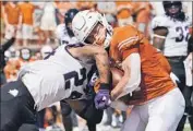  ?? Eric Gay Associated Press ?? TEXAS RECEIVER Jake Smith (7) is hit by Texas Christian safety Ar'Darius Washington as he scores.