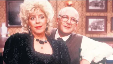  ??  ?? > ‘We were just like a married couple’ – Julie Goodyear with Roy Barracloug­h in Coronation Street in 1988