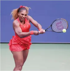  ?? — AFP photos ?? Serena returns the ball during her first round match against Kristie Ahn of the US at the USTA Billie Jean King National Tennis Center.