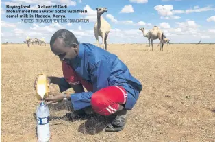 ?? PHOTOS: THOMSON REUTERS FOUNDATION ?? Buying local . . . A client of Gedi Mohammed fills a water bottle with fresh camel milk in Hadado, Kenya.