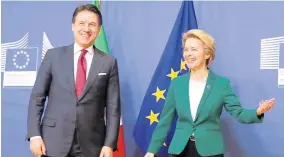  ?? AP ?? European Commission President Ursula von der Leyen (right) greets Italian Prime Minister Giuseppe Conte prior to a meeting at EU headquarte­rs in Brussels, on Tuesday, February 4.