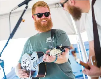  ?? KENDALL WARNER/VIRGINIAN-PILOT ?? Oliver Anthony, seen performing Aug. 19 in North Carolina, has become an overnight sensation thanks to his song “Rich Men North of Richmond.”