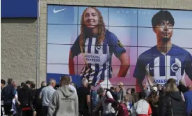  ?? Community Stadium. Photograph: Matt Impey/Shuttersto­ck ?? Photograph­s of Katie Robinson and Kaoru Mitoma on the club store at Brighton’s Amex